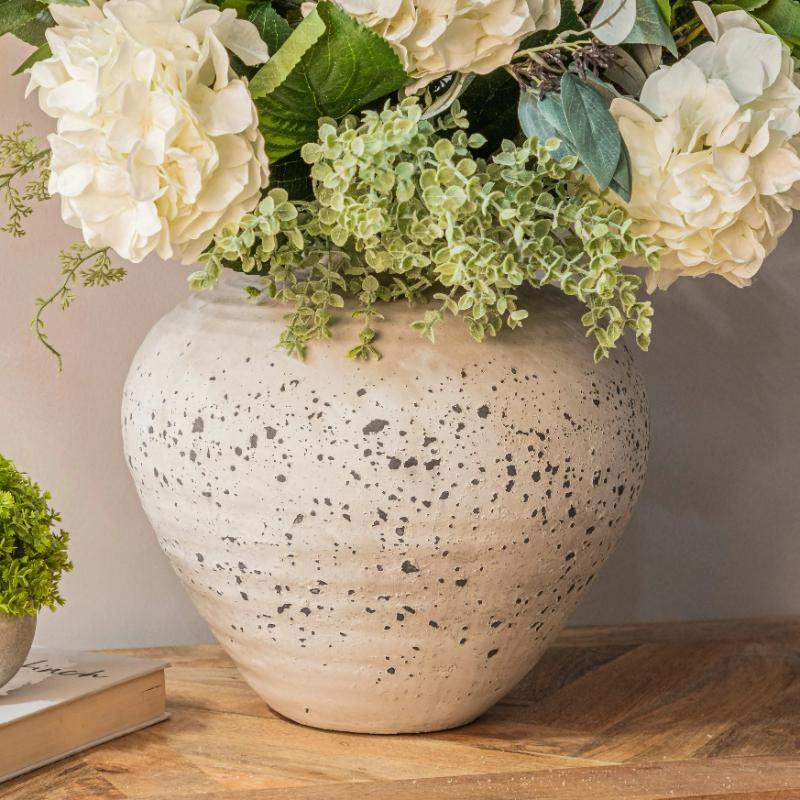 Minimal ceramic vase with soft, natural tones